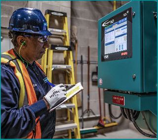 CIMCO technician performing industrial refrigeration preventive maintenance